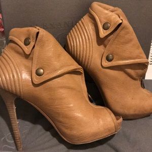 Alexander McQueen skull zip leather ankle boots.